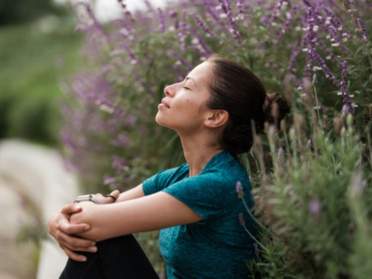 Woman taking a deep calming breath