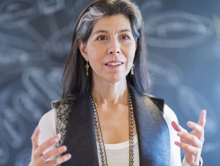 ESL teacher in front of a chalkboard