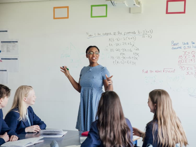 female teacher using literacy in mathematics content instruction