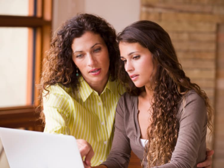 A mom helping her student study for standardize testing