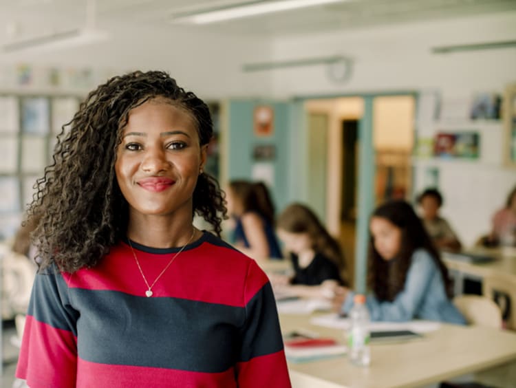 headshot of female teacher in classroom