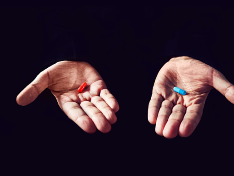 Man offers a red pill or a blue pill