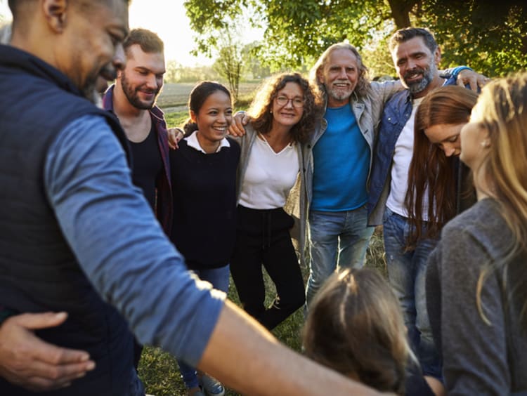 Group of believers linking arms and finding strength in numbers