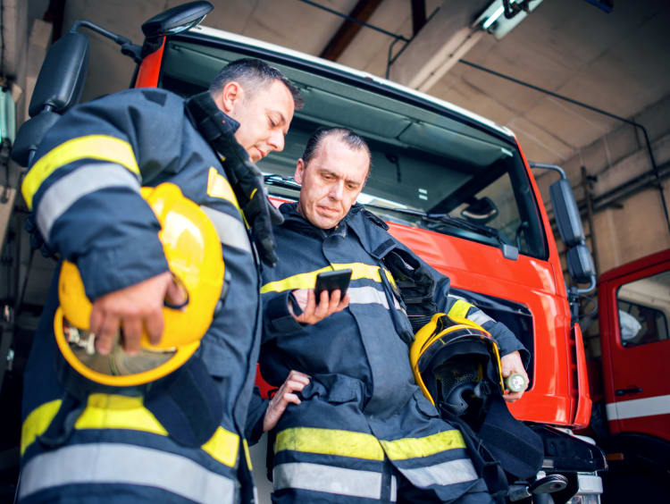 Firefighters talking to each other