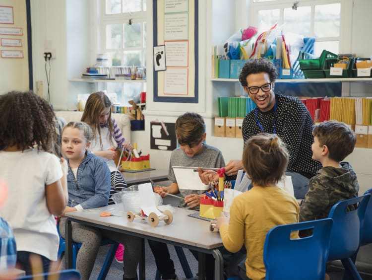 Elementary students completing a project