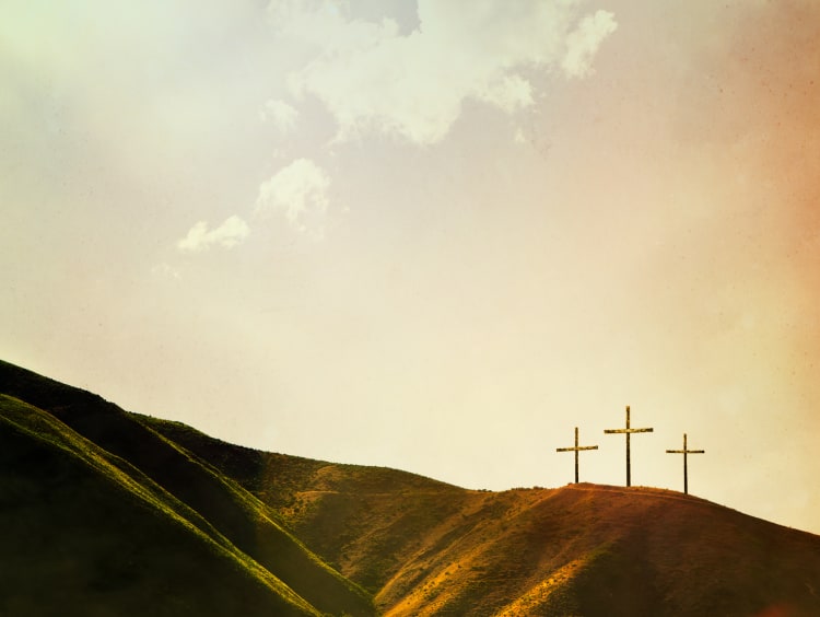 Three crosses on a hillside