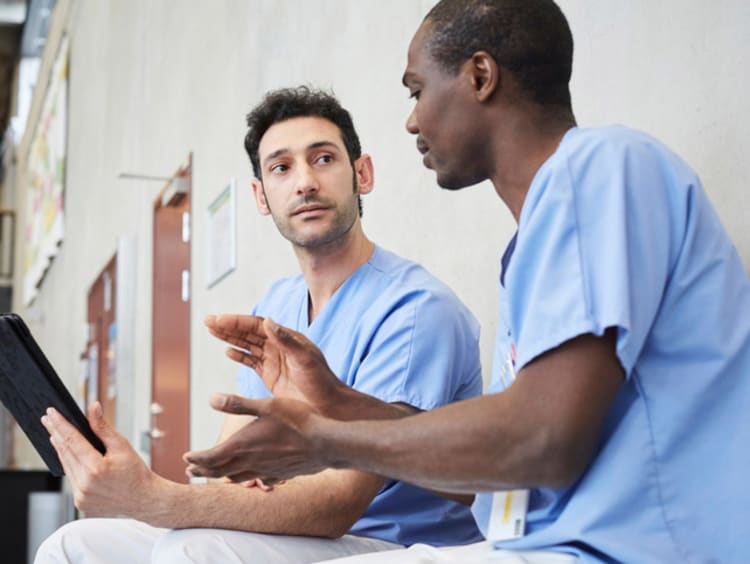 two nurses talking to each other