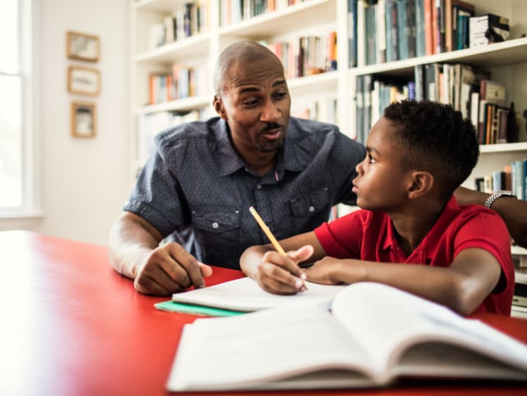 dad helping his son with homework