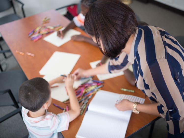special education teacher drawing with student
