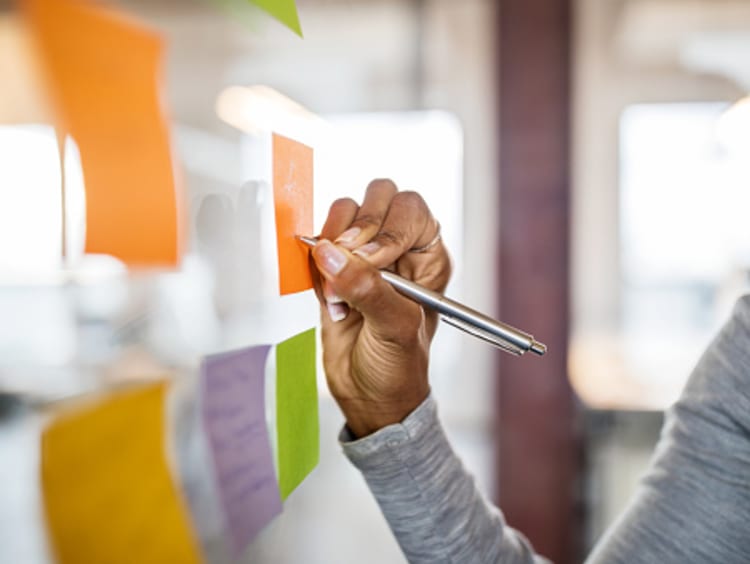 hand writing on a sticky note