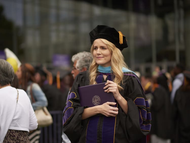 GCU doctoral student with her PhD degree