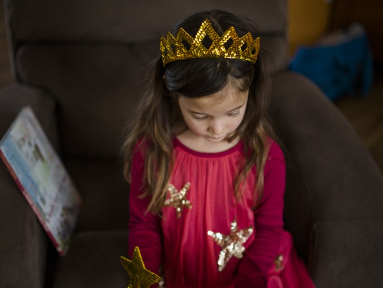 girl in kindergarten class learning from a teacher with an early childhood education degree