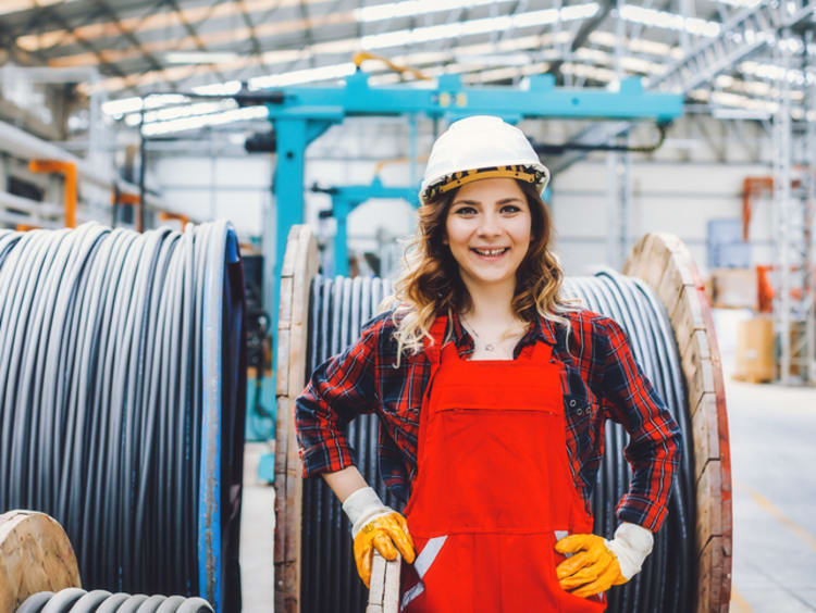 young mechanical engineer woman working in a factory