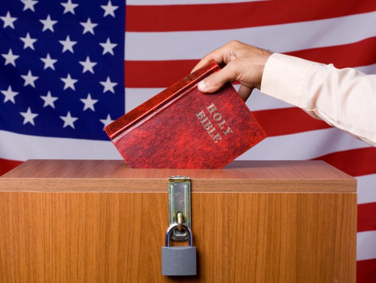 a Chrsitian individual placing their ballot in a voting box