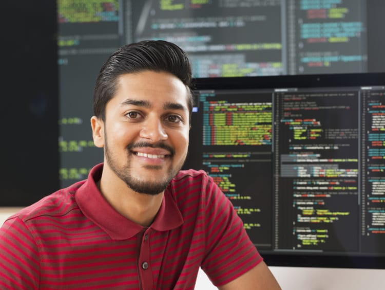 a cybersecurity job candidate sitting in front of servers