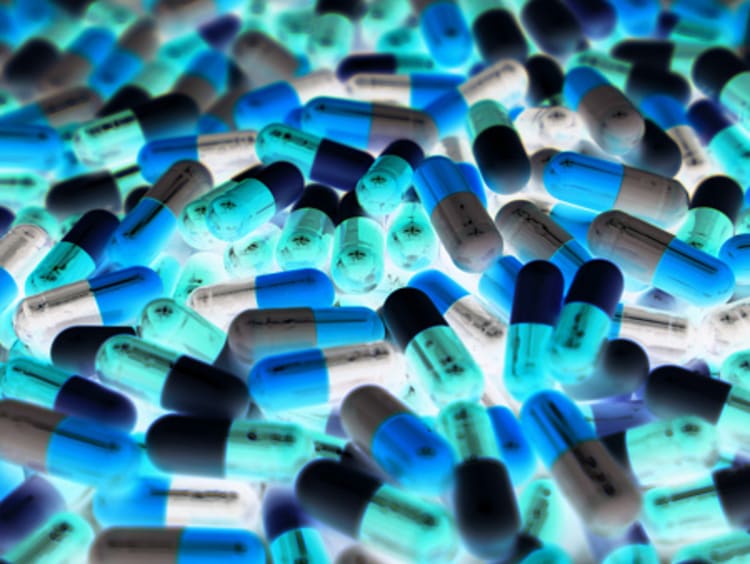 drug pills piled inside of a toxicology lab