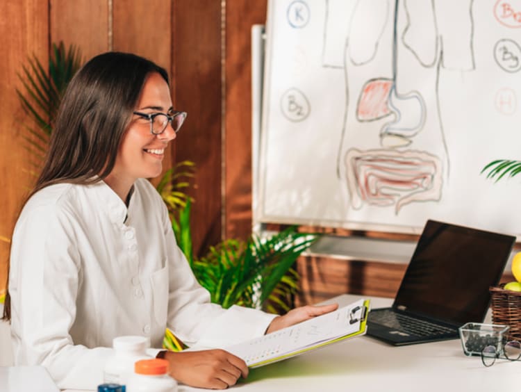 nutritionist working with client in her office