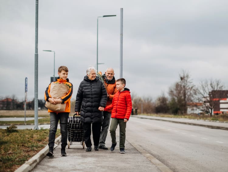 Family serving each other and walking down the road