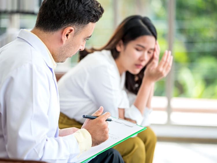 A mental health counselor talking to his client