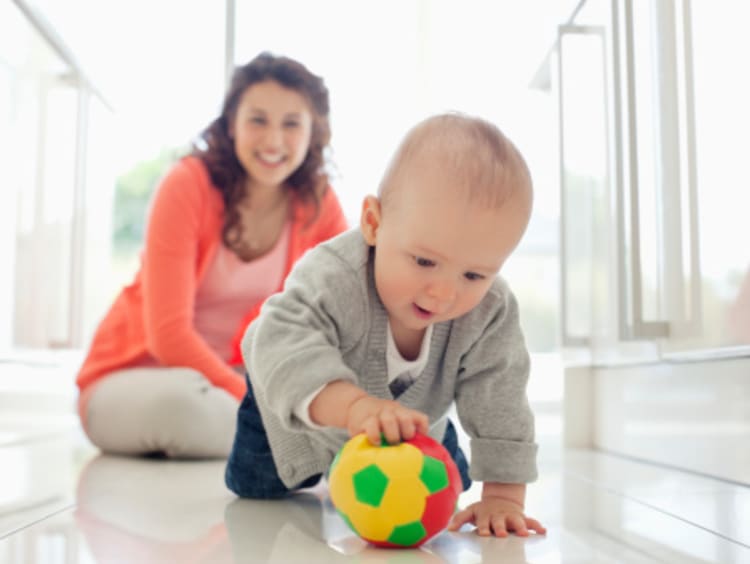 A childhood development specialist helping a child 