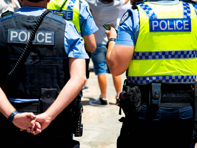 Two police officers of different ranks standing next to each other