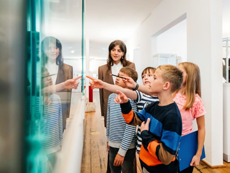 Neighborhood friends at school looking at an exhibit