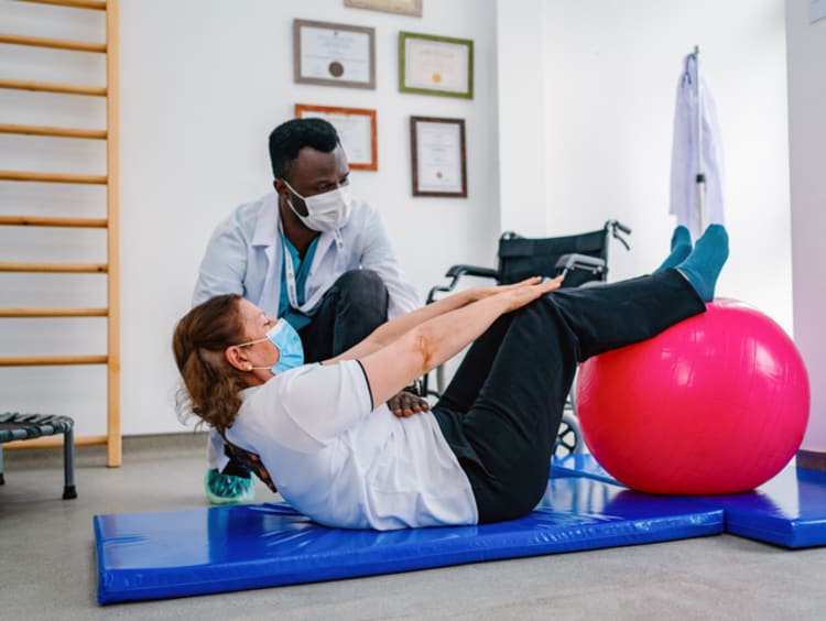 Sports Psychologists helping a person with exercise