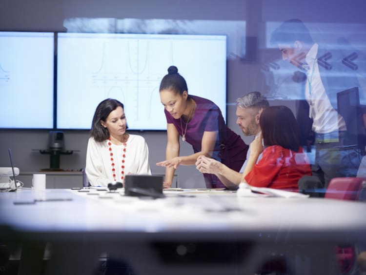 A leader giving instruction during a team meeting