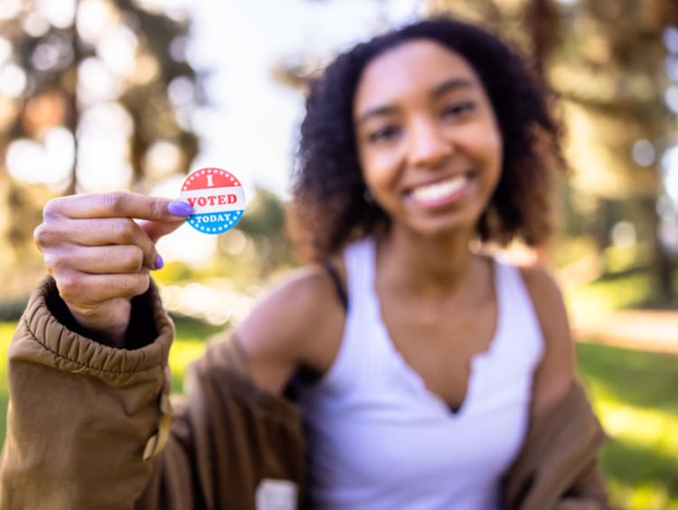 College-aged female with I Voted sticker