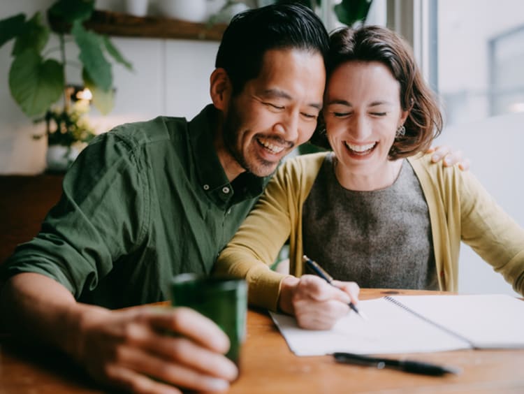 Husband and wife working on a budget