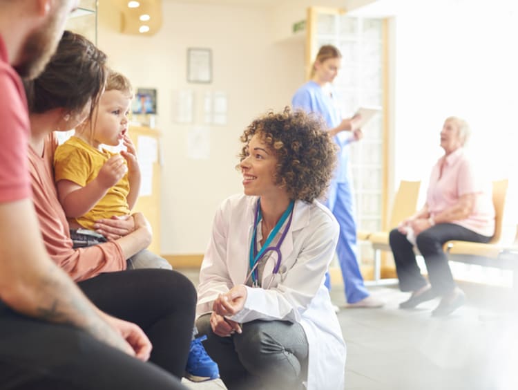 Family nurse practitioner talking with patients