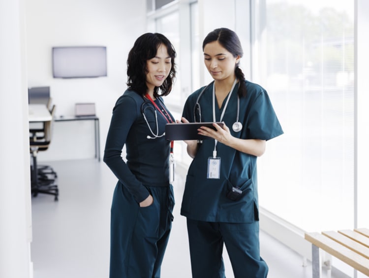 Nurses discussing patient's chart