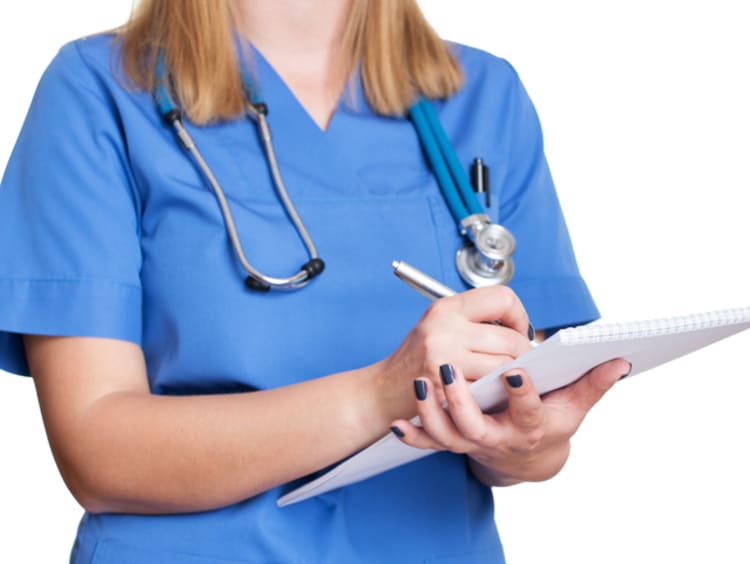 A female nurse with a stethoscope and notebook