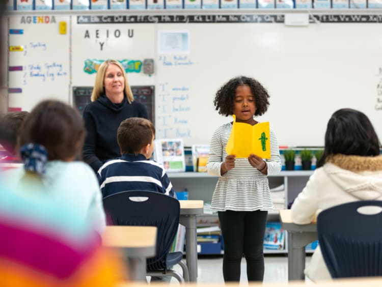 A girl giving a presentation to her classmates