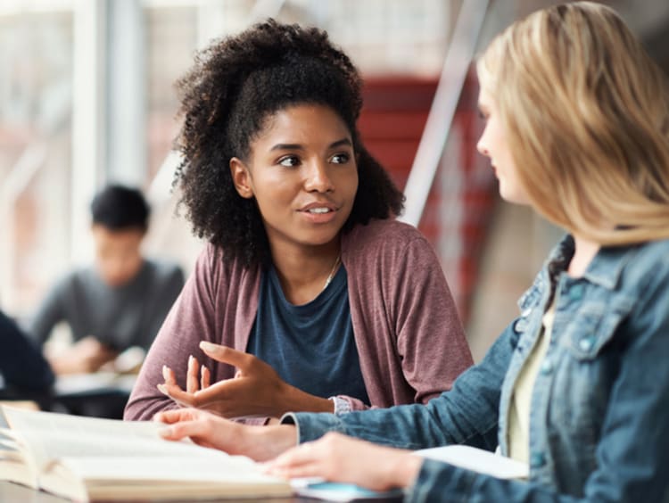 Female college students discussing public administration