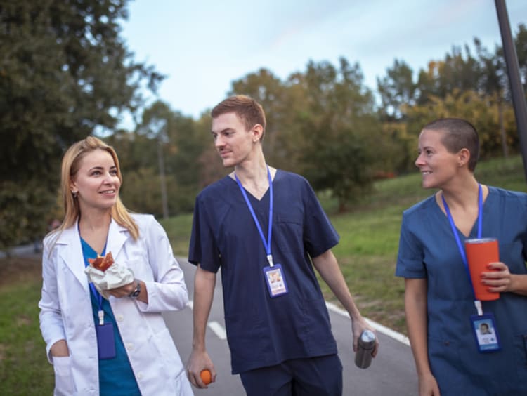 three nurses taking a walk together on a lunch break