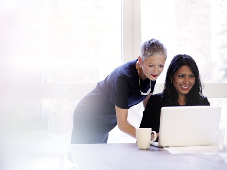 Older professional woman mentoring a younger woman