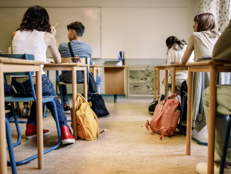 High school students sitting at their desks in a classroom