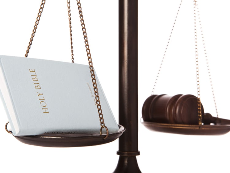 Bible and gavel on scale - stock photo