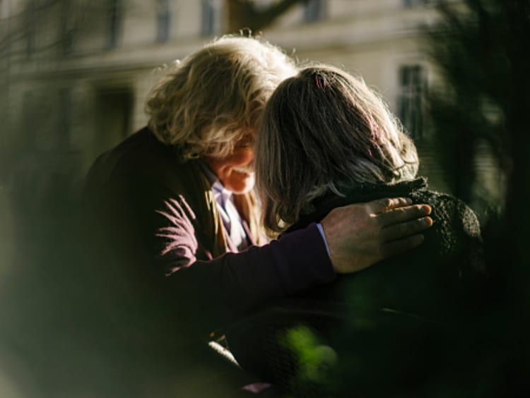 women praying for each other