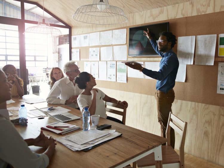 A group of people in a business meeting