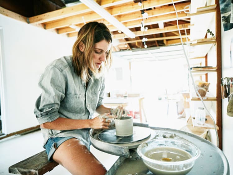 Woman playing with clay