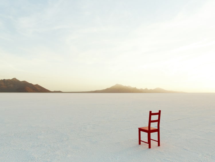 Red Chair on salt flats, facing the distance - stock photo
