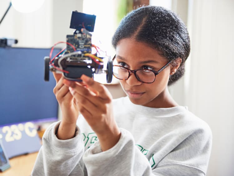 Engineering student checking her project.