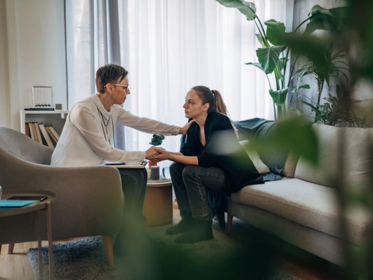 Victimologist providing comfort to victim.