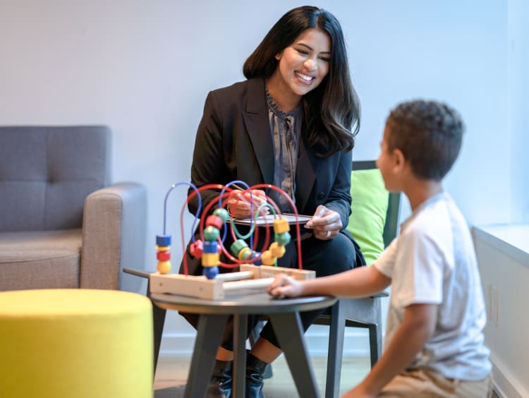 Child life specialist working with a young child