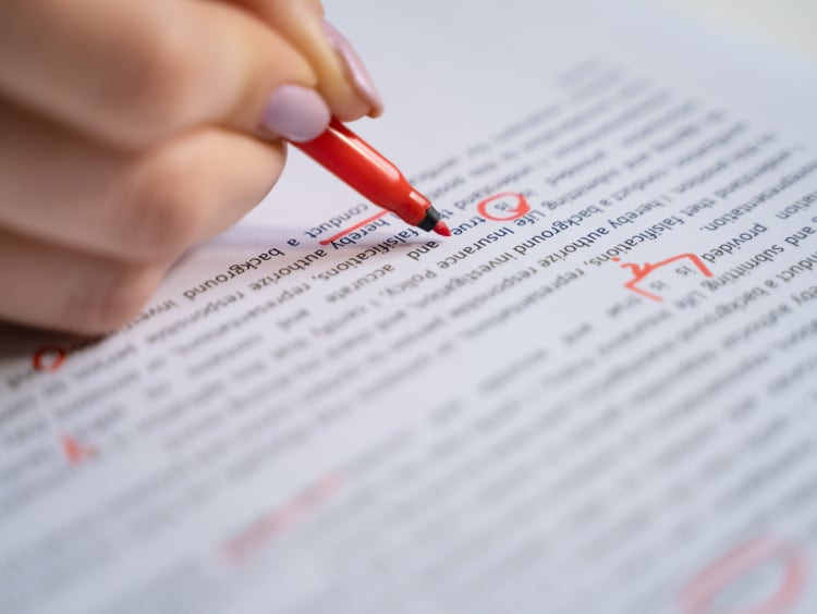 red pen editing a document