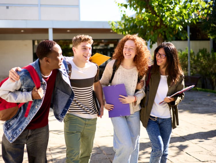 small group of students walking and laughing