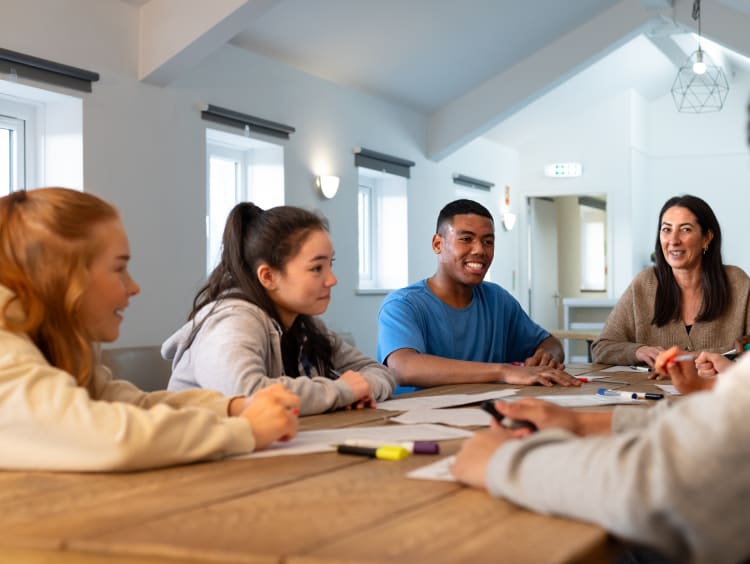 sociology students meeting around a table