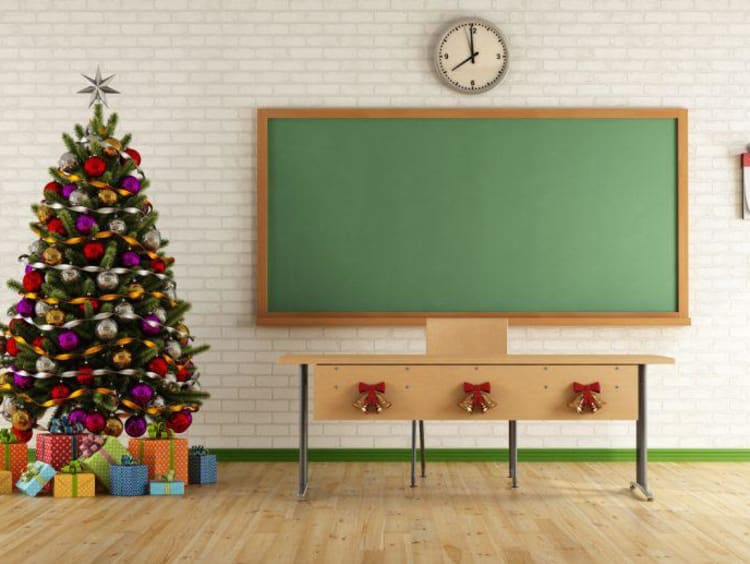 Christmas tree next to blackboard